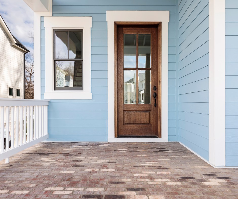 Blue front porch with stained front door and white trim exterior painting in Columbus