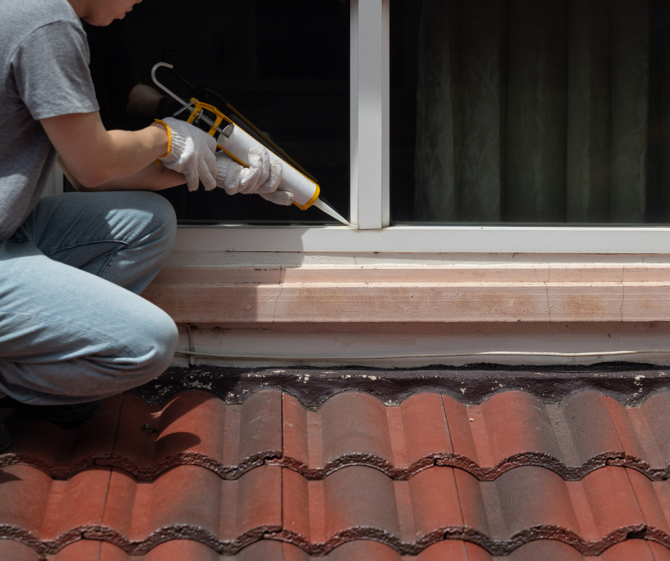 Columbus painting contractor in Nebraska caulks exterior window and trim 